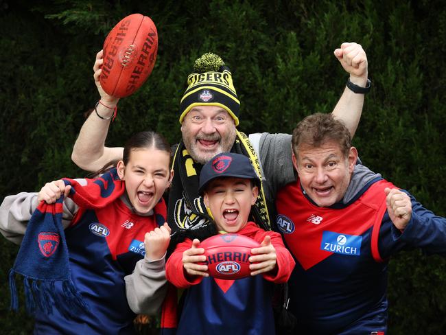 AFL Crowd Numbers. Melbourne Demons and Richmond Tiger fans Alexis 11 (Melb), James 9, (Melb) Ron Issko (Rich) and Barry Helfenbaum (Melb).                         Picture: David Caird