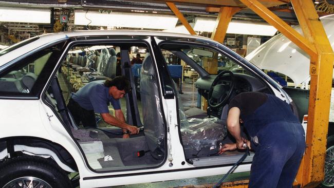 The good old days: Seats and interior trim are fitted to the Commodore at Holden's Elizabeth car plant in the 1990s.