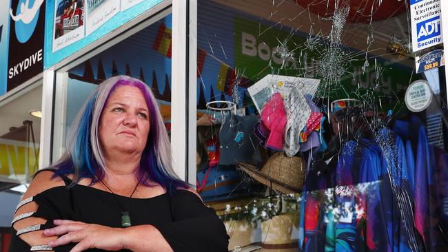 Adventure Cairns and Beyond owner Erryn "Ezzy" Wells is fed up with crime near her travel agency on Lake Street in the CBD. On Wednesday night she had a $4000 window smashed which she can't afford to replace, as Government imposed Covid restrictions and now vaccination mandates have severely impacted her business income. Picture: Brendan Radke.