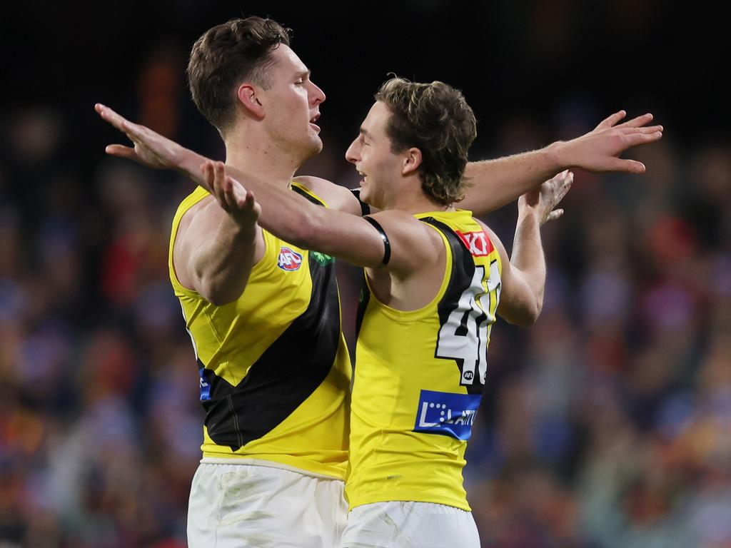 Jacob Koschitzke and Tyler Sonsie celebrate after their win over Adelaide. Picture: James Elsby/AFL Photos via Getty Images.