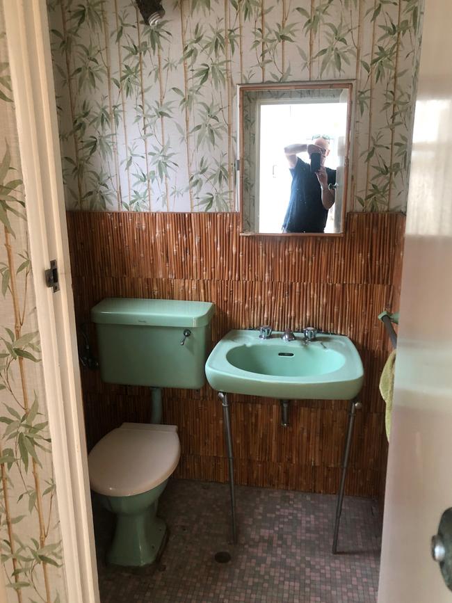 The bamboo-wallpaper bathroom also needed work. Picture: Supplied