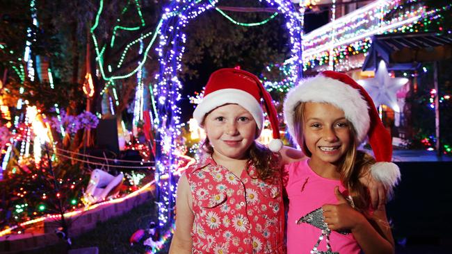 Kellyann Earl 7, of Collarenebri, and Shayla Walsh 8, of Leeton, from Royal Far West toured the Christmas lights at Davidson. Picture: Braden Fastier