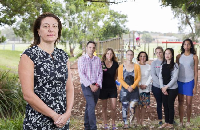 Chairwoman Christina Curry with some of those behind the shelter. Picture: AAP/Matthew Vasilescu