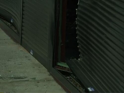 It is understood the offenders rammed a car into the front security roller shutter. Picture: 9 News