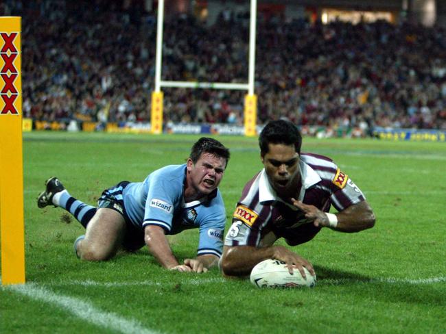 Matt Sing crashes over in 2003.