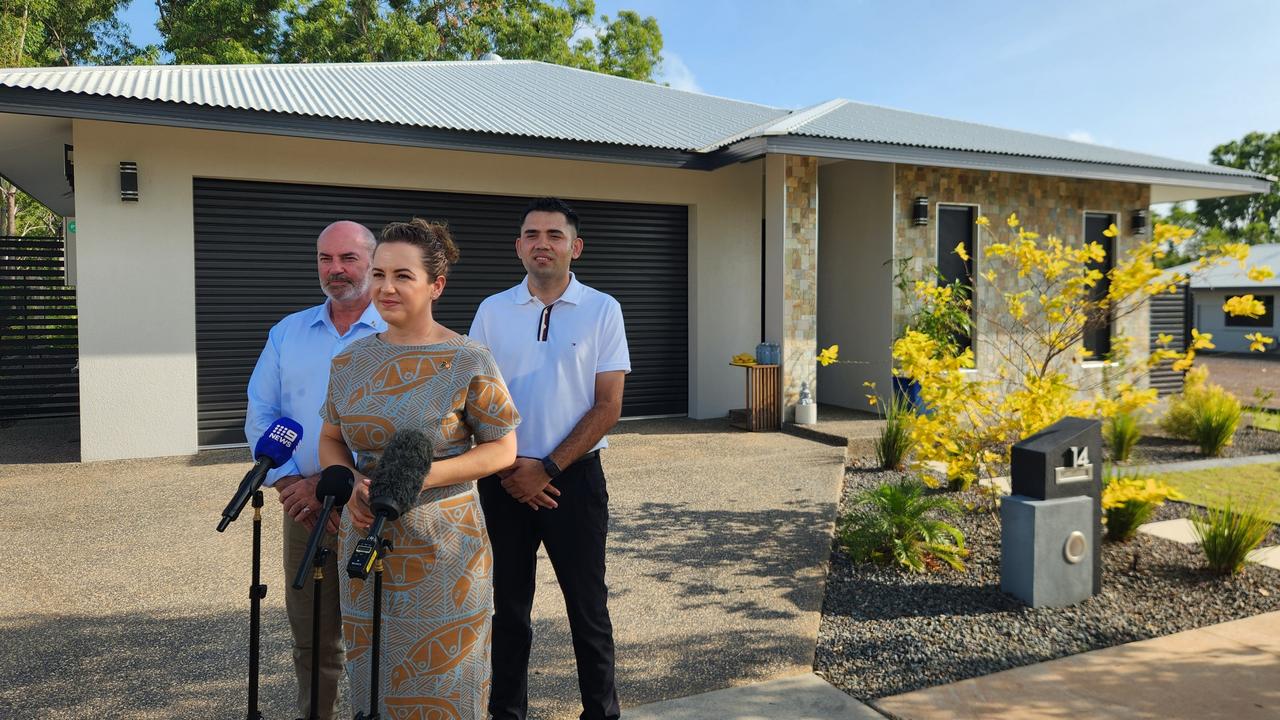 Chief Minister Lia Finocchiaro and Treasurer Bill Yan spoke with new homeowner Roshan Sapkota outside his residence in Lee Point. Picture: Darcy Fitzgerald