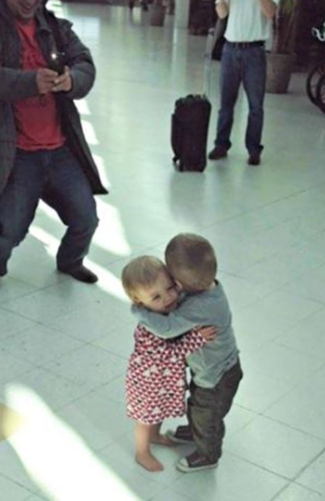 The best bit about this is neither of these children knew each other – they just started hugging it out in the middle of the airport. Picture: Reddit