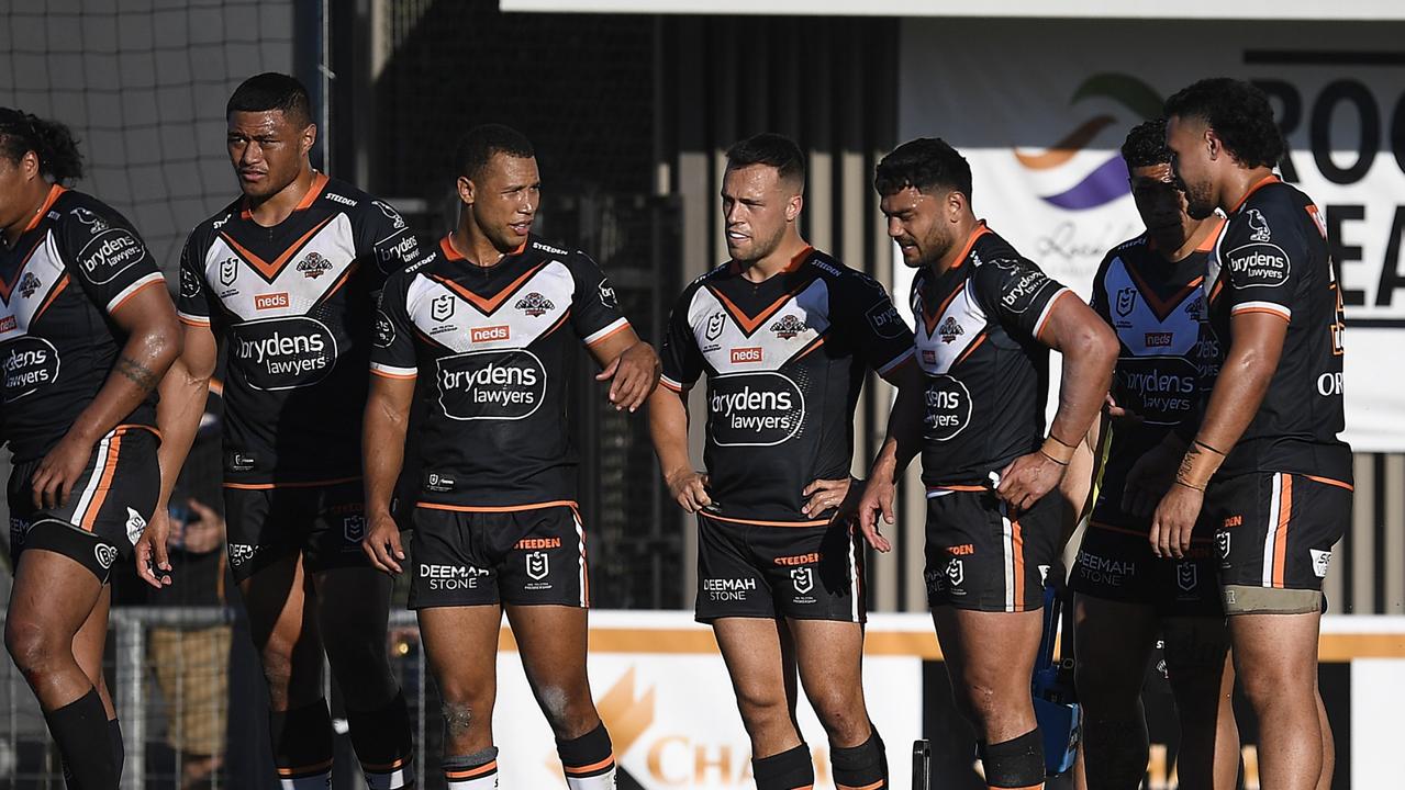 ROCKHAMPTON, AUSTRALIA - AUGUST 21: The Tigers look on after a Sharks try during the round 23 NRL match between the Wests Tigers and the Cronulla Sharks at Browne Park, on August 21, 2021, in Rockhampton, Australia. (Photo by Ian Hitchcock/Getty Images)