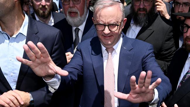 Prime Minister Anthony Albanese leaves after visiting the Adass Israel Synagogue after a firebombing in Melbourne, Tuesday, December 10, 2024. (AAP Image/Joel Carrett) NO ARCHIVING