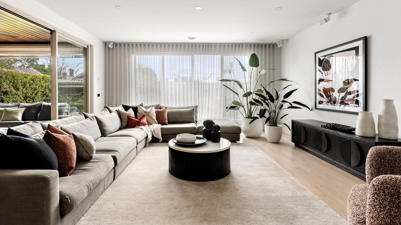 The large open plan living area that connects to the dining zone and kitchen.