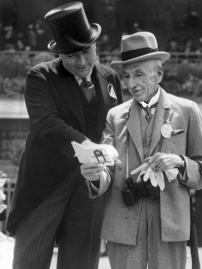 Former Prime Minister Billy Hughes discusses prospects with the federal Attorney-General, Robert Menzies, at the Derby at Flemington in the 1930s.