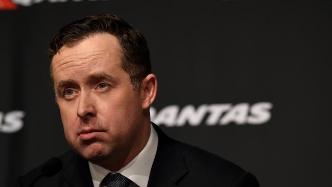 Qantas chief executive Alan Joyce announces the airline's full year results in Sydney on Thursday, Aug. 28, 2014. Qantas has posted a bottom line net loss of $2.84 billion for the year to June 30, compared to a $1 million profit a year ago. (AAP Image/Paul Miller) NO ARCHIVING