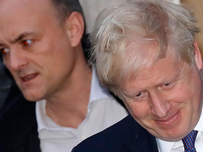 (FILES) In this file photo taken on October 28, 2019 Britain's Prime Minister Boris Johnson (R) and Number 10 special advisor Dominic Cummings leave from 10 Downing Street in central London. - One of British Prime Minister Boris Johnson's top advisers, Dominic Cummings, drew police attention after allegedly breaking the coronavirus lockdown, reports said on May 22. Cummings left his London home to stay with his parents in Durham, northeast England, while suffering symptoms of COVID-19, the Daily Mirror and The Guardian newspapers said. (Photo by Tolga AKMEN / AFP)