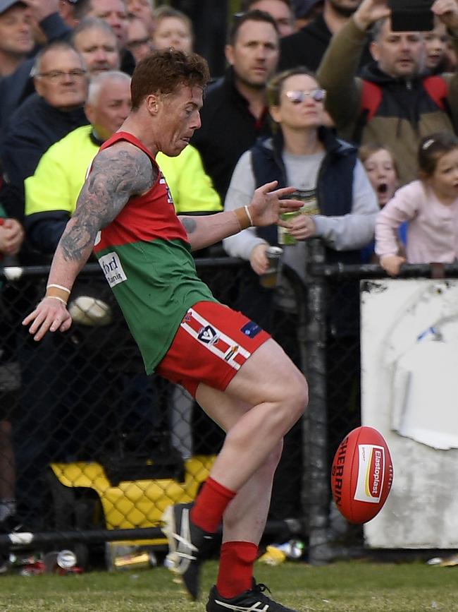 Aaron Ludewig kicks the winning point after the siren during the MPNFL Division 1 grand final. Picture: Andy Brownbill.