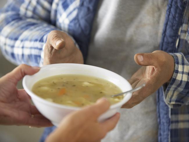 Homeless man soup kitchen poverty elderly generic