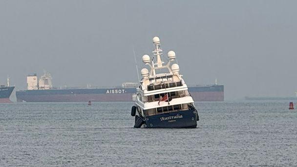 Clive Palmer’s superyacht Australia ran aground off Singapore’s Sentosa beach.