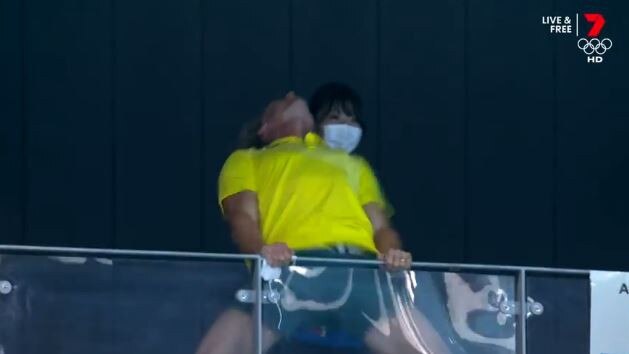 Ariarne Titmus’s coach Dean Boxall celebrates in the stands after her gold medal performance. Picture: Channel 7