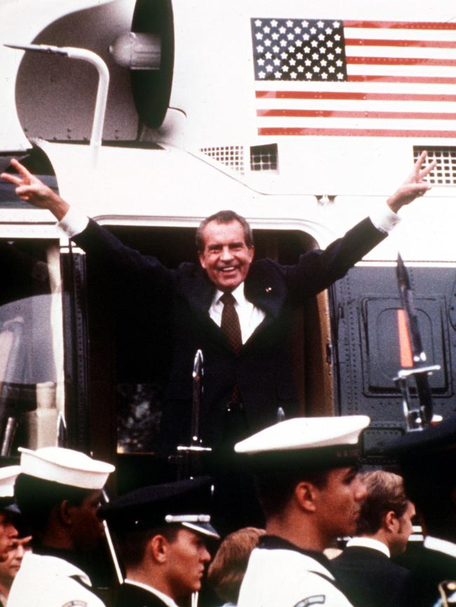 Richard Nixon gives the V-sign before leaving the White House for the last time. Picture: Getty Images