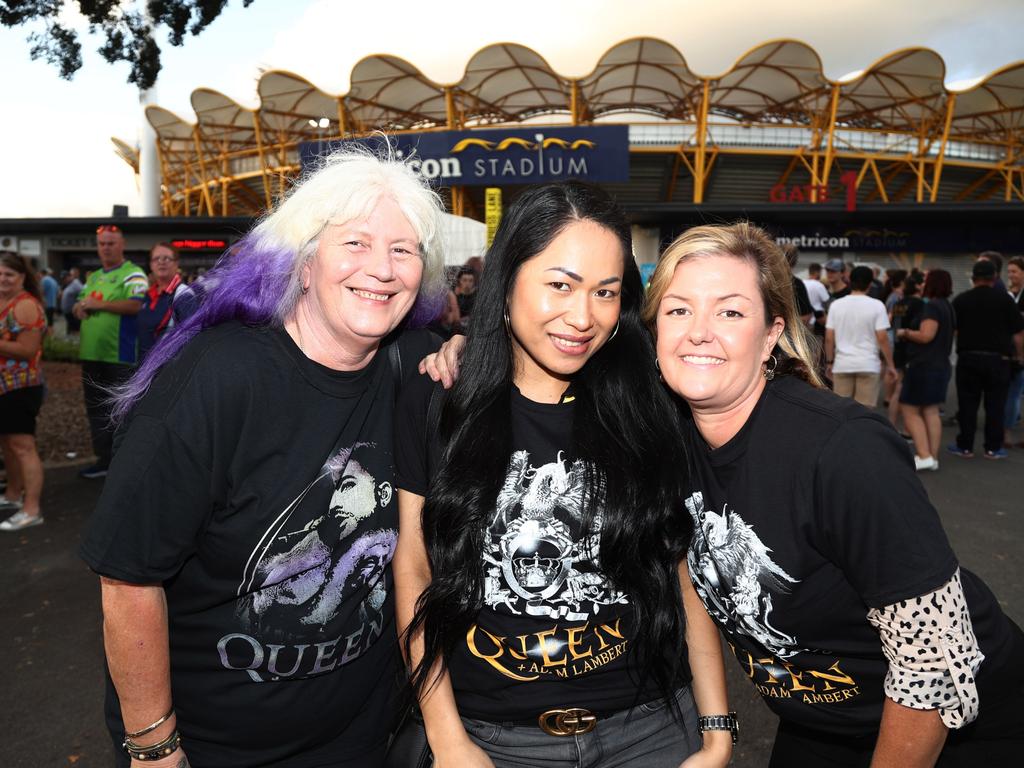 Maree Anderson, Nina Lee and Mel McDonald from Pacific Pines arrive at Metricon Stadium to see Queen Live. Photograph: Jason O'Brien