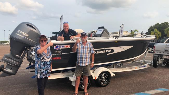 Veronica and Geoff Warham with Stewart Zanker, centre, in front of their new boat. Picture: Stewart Zanker