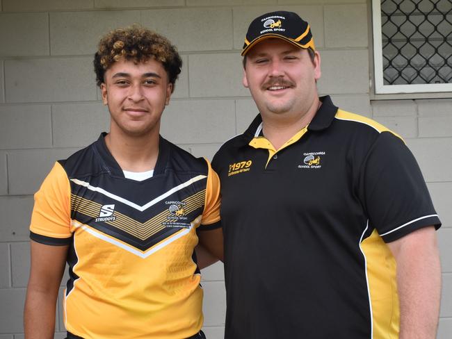 Capricorn 14-15 years boys player Zion Green with coach Lachlan Hall at the Queensland School Sport rugby league state championships at Marley Brown Oval, Gladstone, on May 17, 2025.