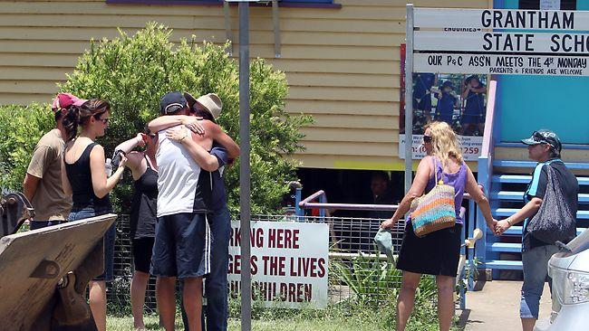 Family and friends arrive at the Grantham State School for the official release of the list containing the names of the confirmed dead and missing. Picture: Stuart Mcevoy