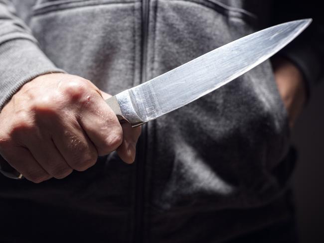 Generic crime Istock  -  Criminal with knife weapon threatening to stab