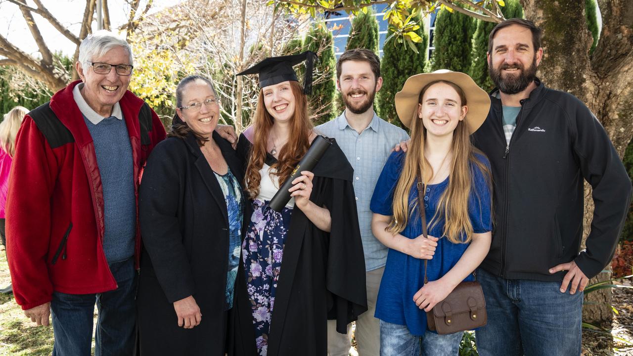 Bachelor of Education (Secondary) graduate Madeleine Buchanan celebrates with (from left) George Raeside, Jen Buchanan, Jake Buchanan, Mackenzie Buchanan and Sean Buchanan at a UniSQ graduation ceremony at Empire Theatres, Tuesday, June 27, 2023. Picture: Kevin Farmer