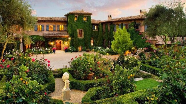 Lush gardens surround the pink mansion. Picture: MOTOVO