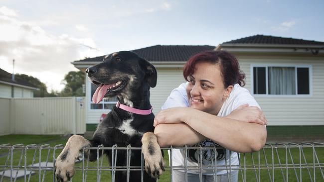 Rocky's K9 Rescue is managed by Merna Karam, who is pictured with another happy pooch.