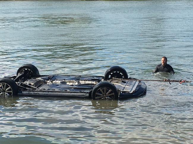 Young female driver is caught by surprise when a Huntsman Spider drops in her lady while parking her car at Bayview boat rap at Mona Vale. Must credit Stuart Cooper