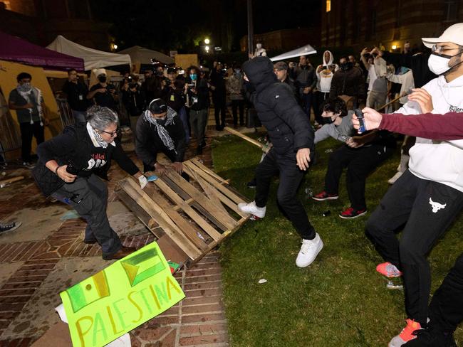 Counter protesters attack pro-Palestinian protesters at a pro-Palestinian encampment at the University of California Los Angeles on May 1. Picture: Etienne Laurent/ AFP