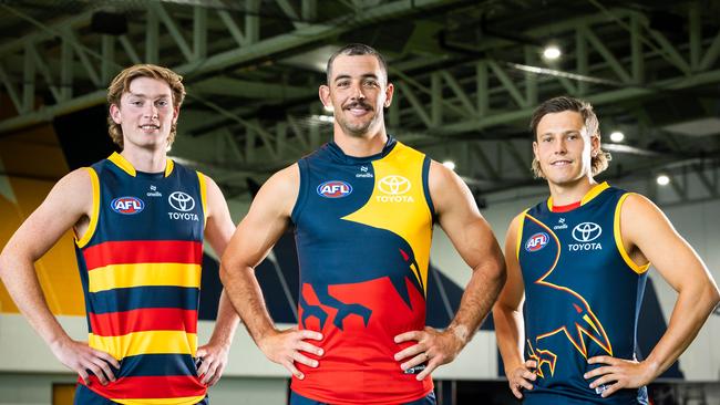 Max Michalanney, Taylor Walker and Jake Soligo in the Crows' guernsey range for 2024.