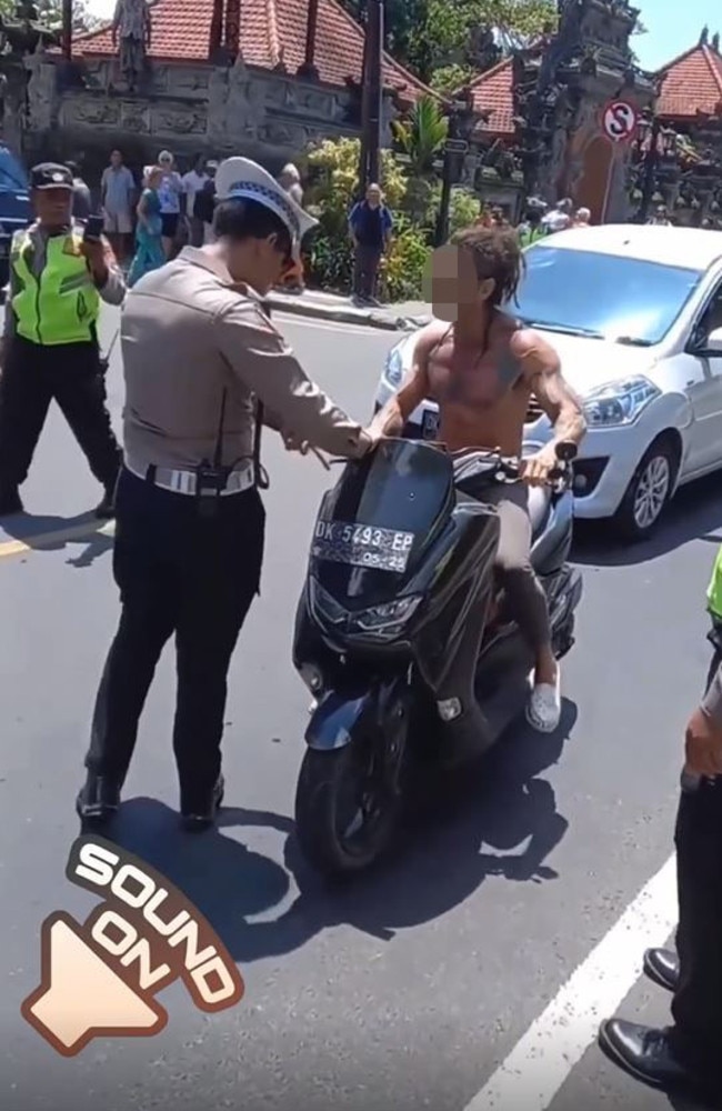 A tourist in Bali was stopped by police for not wearing a helmet. Picture: Instagram/moscow_cabang_bali
