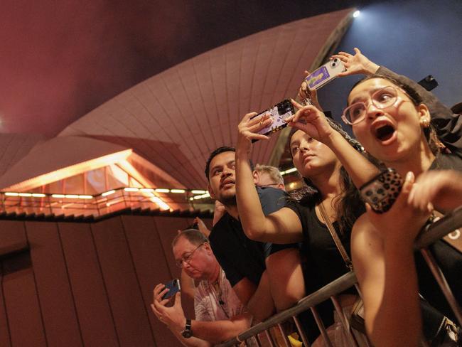 People watch the 9pm fireworks display at the Sydney Opera House on December 31, 2024 in Sydney, Australia. Picture: Brook Mitchell/Getty Images