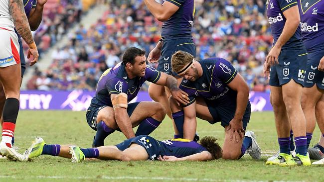 Ryan Papenhuyzen lays motionless after being hit high. Picture: Bradley Kanaris/Getty