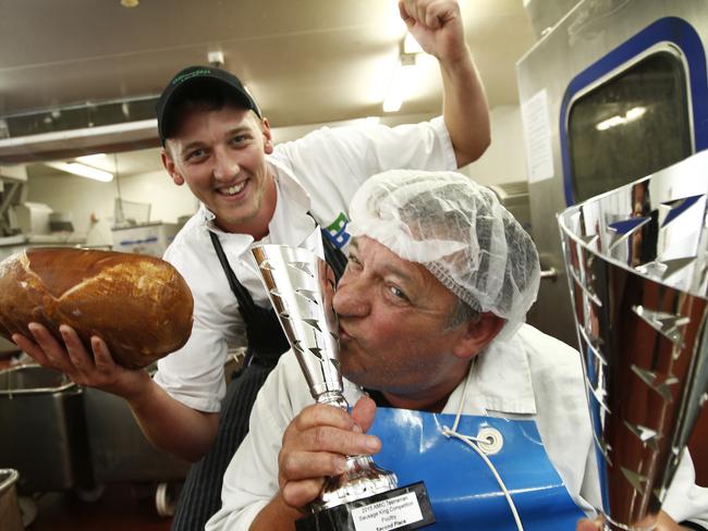 LOcal butcher, TasMeats, wins a national award for ham, it's start of pork week, and we have some succilent leg of hams on the bone ready for Christmas, ,, picture of butcher Nathan Grant with process manager Phillip Bowden in the factory. with ham and trophies,, picture kim eiszele