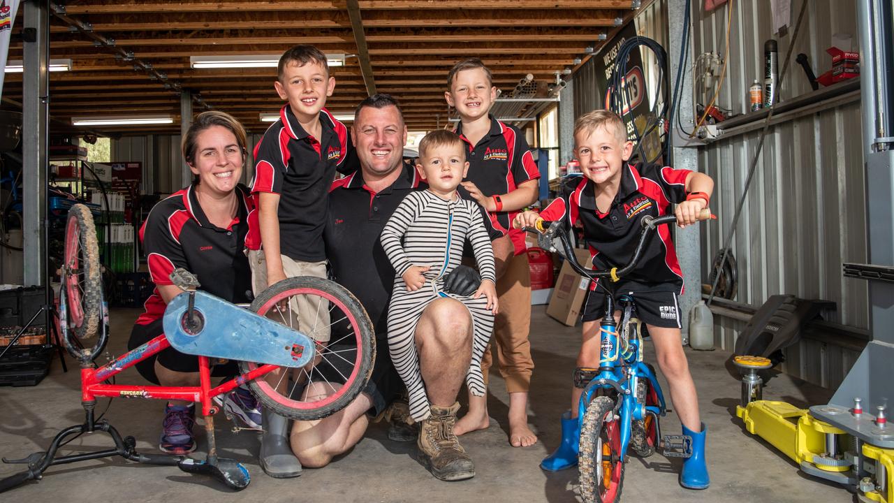 Cassie and Josh Lole, of Auto, Air, Electrical and Mechanical, at Hatton Vale, with four (from five) of their children. PHOTO: ALI KUCHEL.