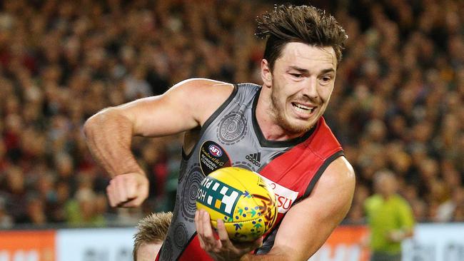 AFL Round 9 — Richmond v Essendon at MCG. Michael Hibberd under pressure from Jack Riewoldt. 30th May 2015. Picture: Colleen Petch.