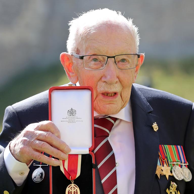 The newly honoured Captain Sir Thomas Moore poses after being awarded with the insignia of Knight Bachelor by the Queen. Picture: Chris Jackson/Getty Images)