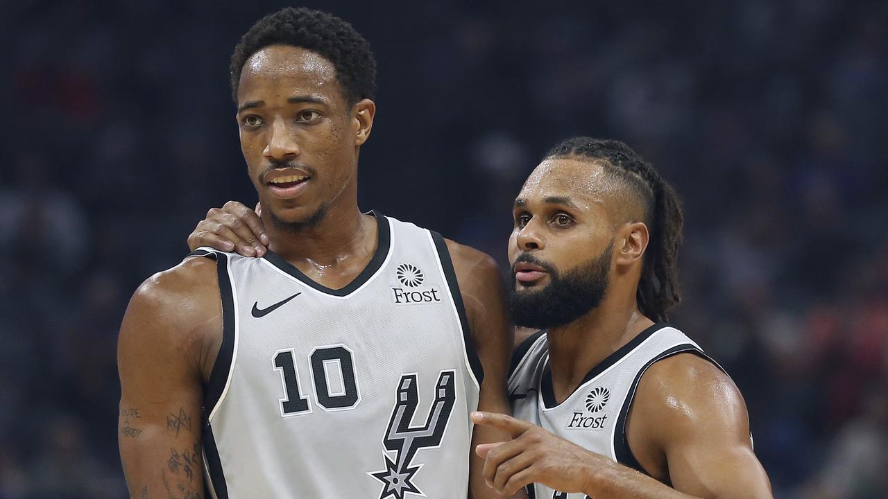 San Antonio Spurs players DeMar DeRozan and Patty Mills earlier in November. The Spurs are slumping. (AP Photo/Rich Pedroncelli)