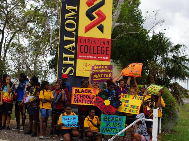 Shalom Christian College students protest out the front of their campus against the closure of the senior school.