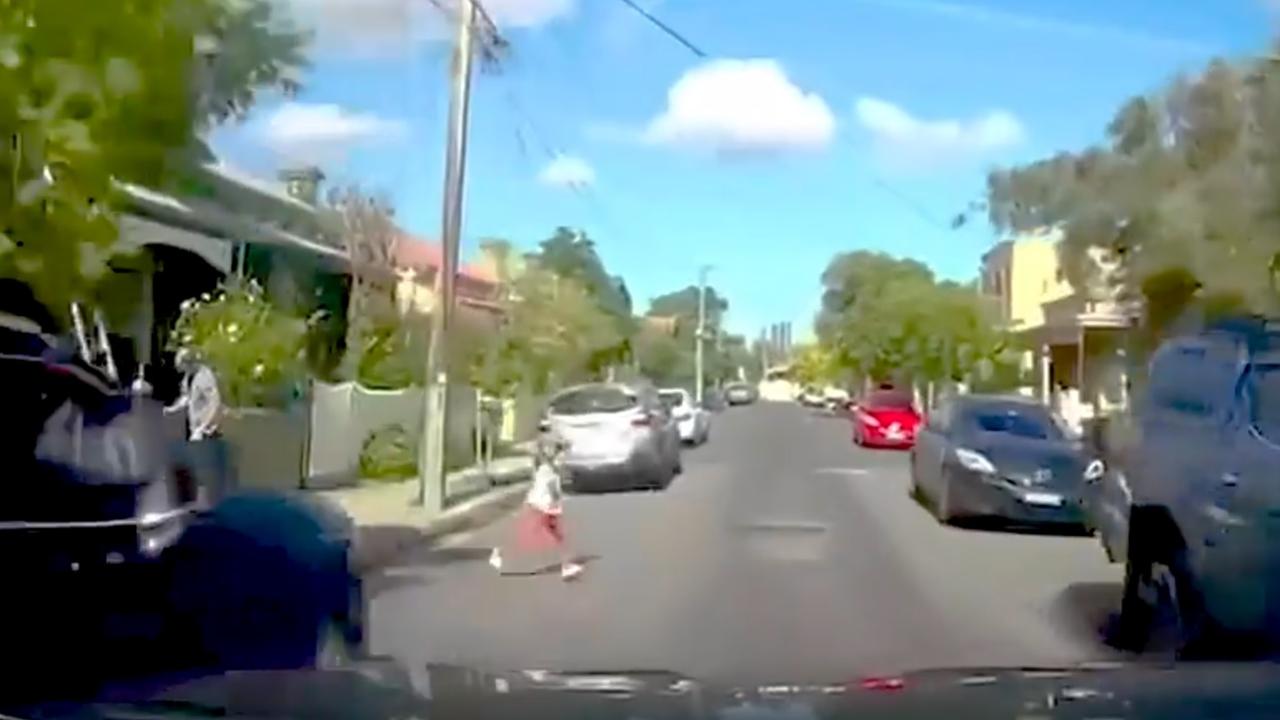 The girl darts into the road. Picture: Picture: DashCamOwnersAustralia/Facebook