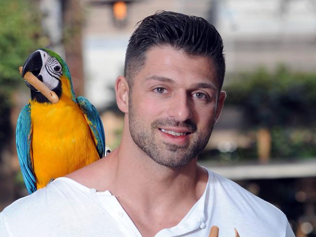 Ramzey Choker with 'Fluffy' the parrot.