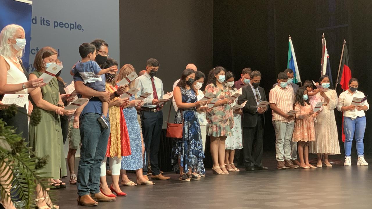 New Aussies read out the affirmation, the final step in becoming an Australian, at the MECC citizenship ceremony on Australia Day, 2022. Wednesday, January 26, 2022. Mackay Australia Day 2022. Mackay Citizenship Ceremony 2022. Picture: Duncan Evans