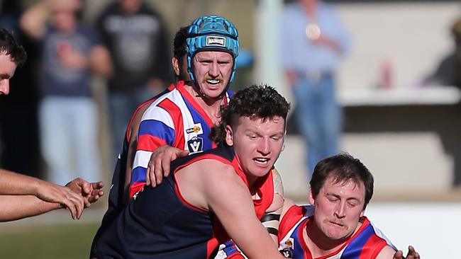 Swifts Creek’s Robert Crellin and Lindenow South’s Bradley Pedder. Picture: Yuri Kouzmin