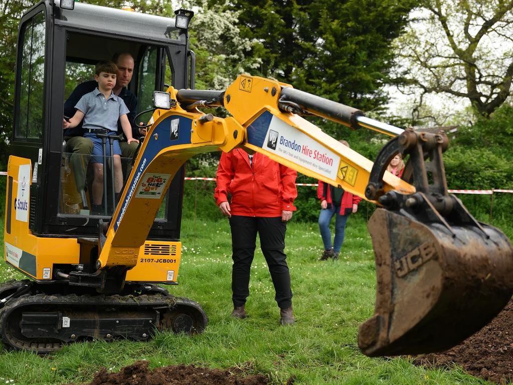 Prince William, Prince of Wales is helped by Prince Louis of Wales (L) as he uses an excavator while taking part in the Big Help Out. Picture: Getty Images