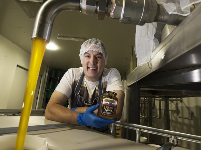 Australian Honey Products manager Jeff Bourke with some of the product used to create a honey sponge topped with an Oomph! coffee and Ashgrove cream parfait for dessert. PICTURE CHRIS KIDD