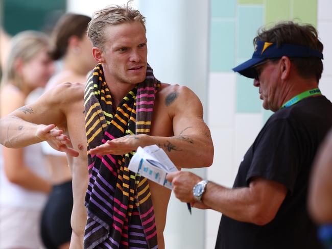 Michael Bohl speaks with Cody Simpson during the 2024 Australian Open Swimming Championships. Picture: Chris Hyde/Getty Images