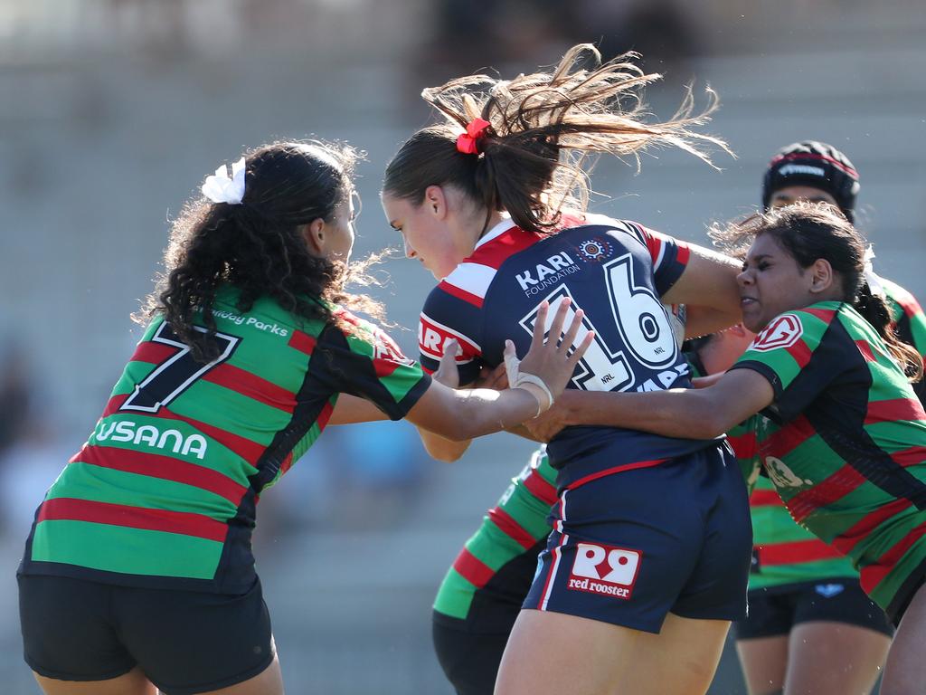 Kiara McGregor and Teearna Williams hold Grace Dabin. Picture: Sue Graham